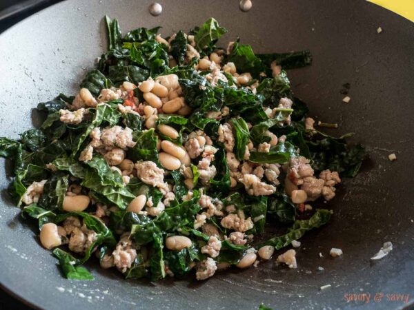 Add kale and mix together until just wilted about 1-2 minutes. Remove from heat. Add salt and pepper to taste. Serve warm with cooked rice, toasted bread or pasta. Top with grated parmesan cheese (optional). Enjoy!